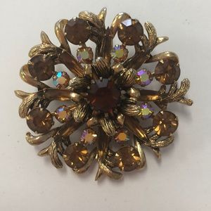 Gold brooch with stones